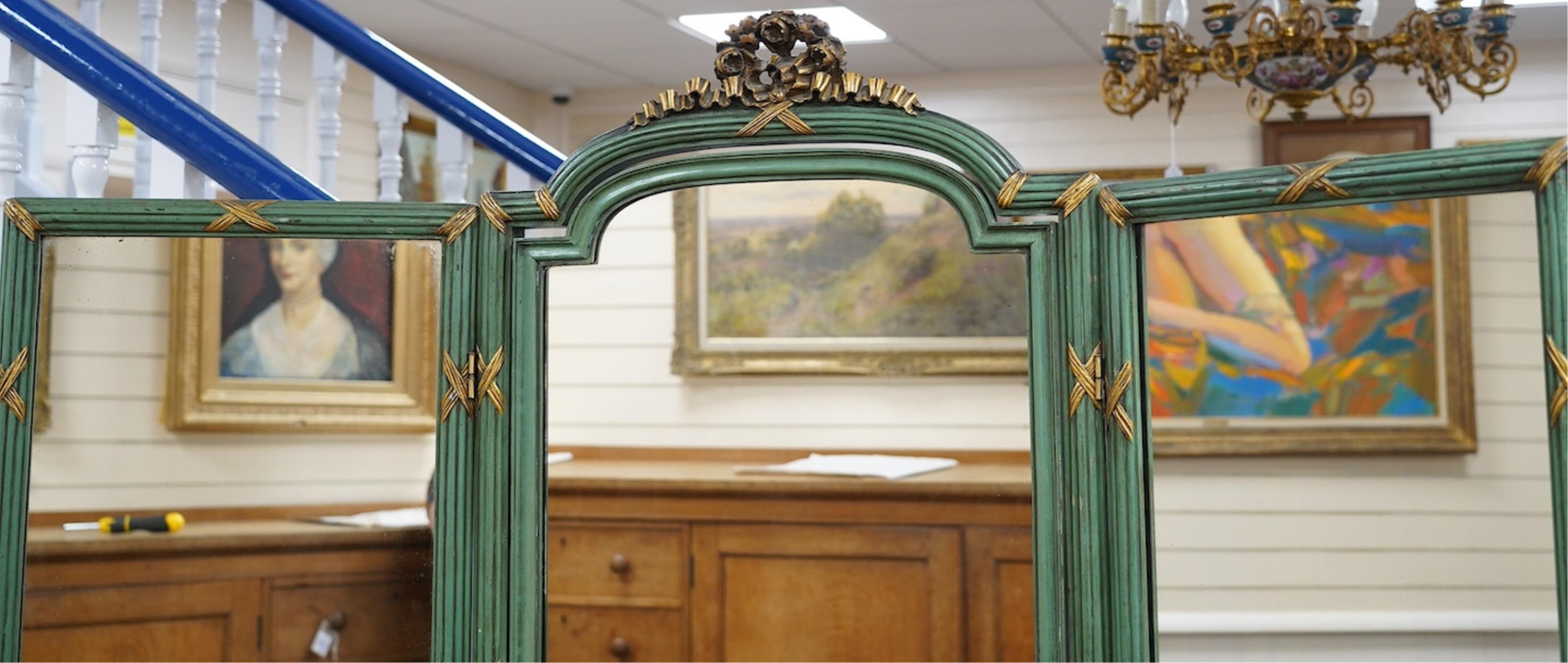 A Louis XVI style green painted and parcel gilt triple folding dressing mirror, width 160cm, height 185cm. Condition - fair